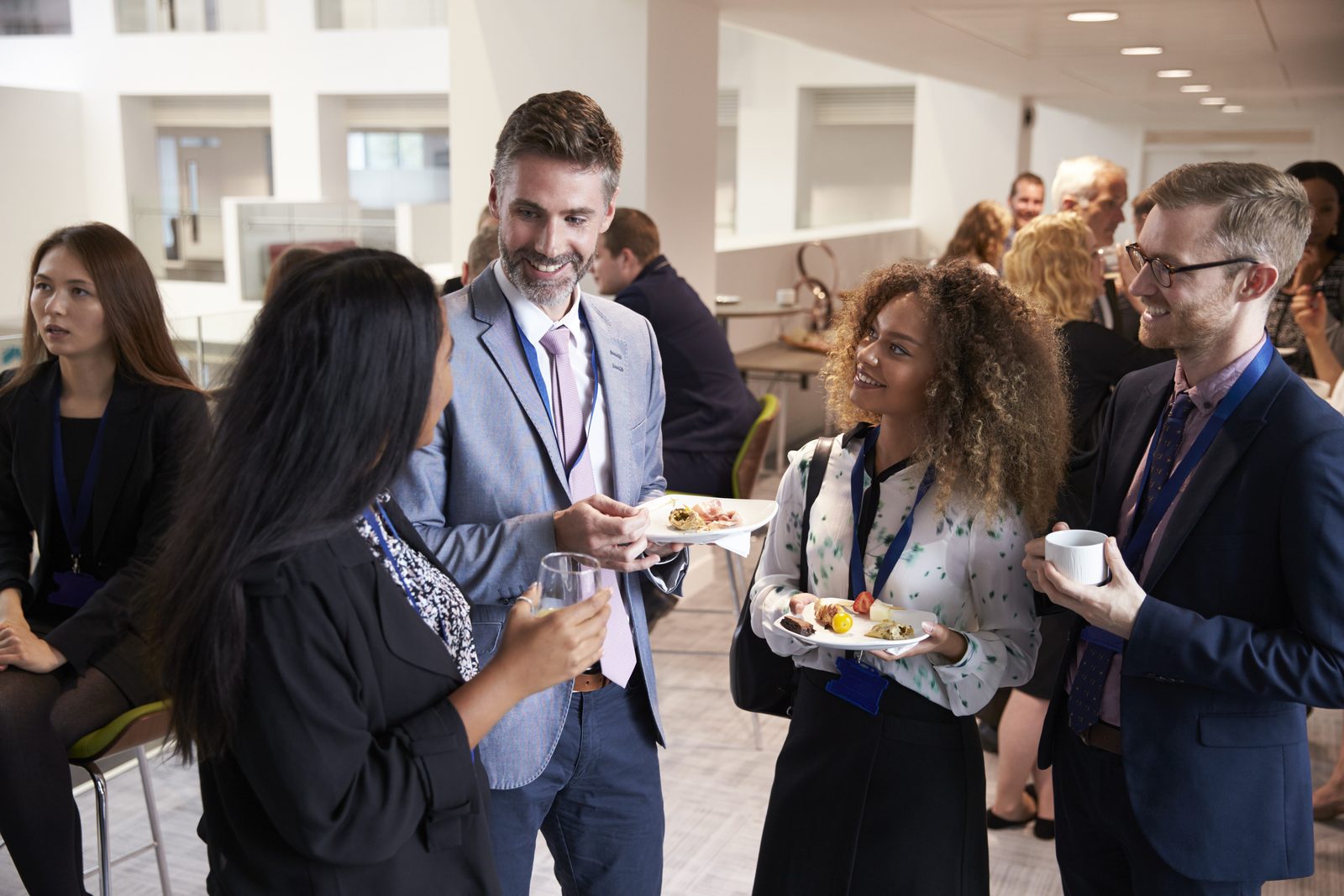 Young professionals networking and building confidence at a professional development event